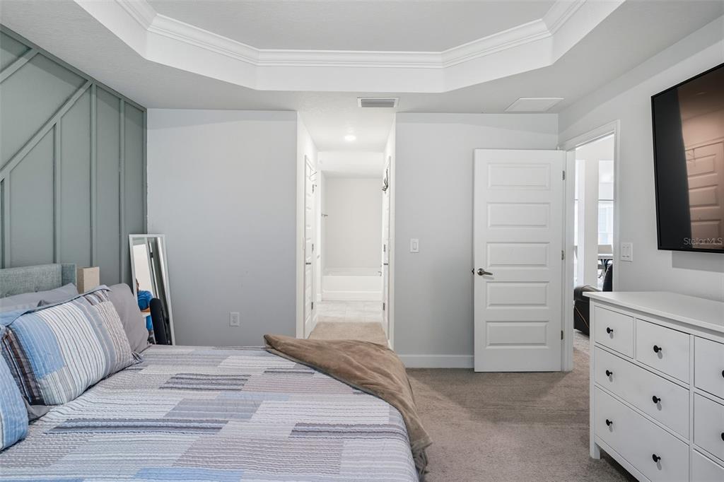 463 Trafalgar Lane Spring Hill, FL 34606 - Photo 21 of 36 a bedroom with a bed and a dresser