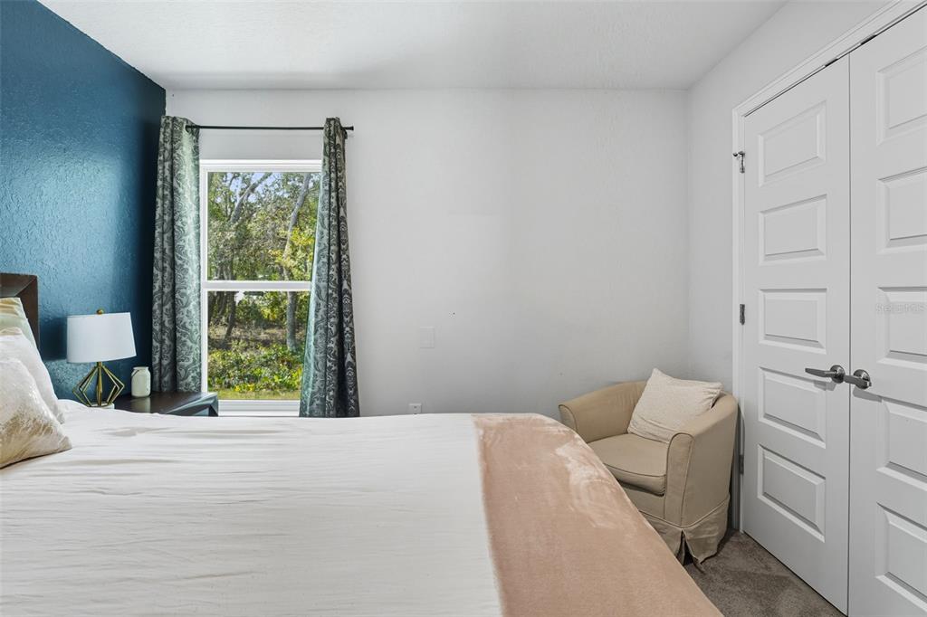 463 Trafalgar Lane Spring Hill, FL 34606 - Photo 26 of 36 a bedroom with a bed and a window