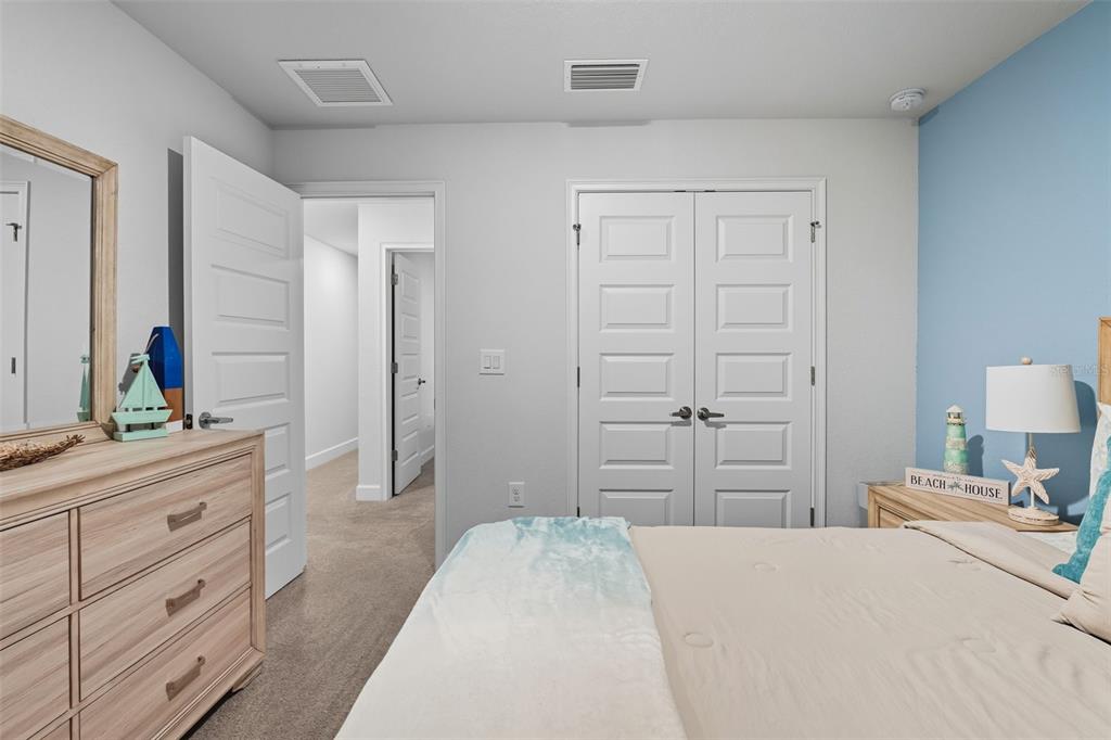 463 Trafalgar Lane Spring Hill, FL 34606 - Photo 29 of 36 a bedroom with a bed and a dresser