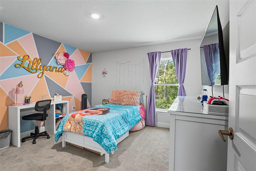 463 Trafalgar Lane Spring Hill, FL 34606 - Photo 31 of 36 a bedroom with a bed and a window