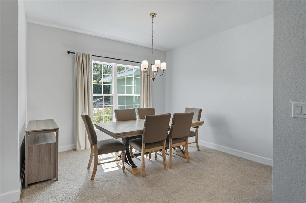 463 Trafalgar Lane Spring Hill, FL 34606 - Photo 6 of 36 a dining room with furniture and window