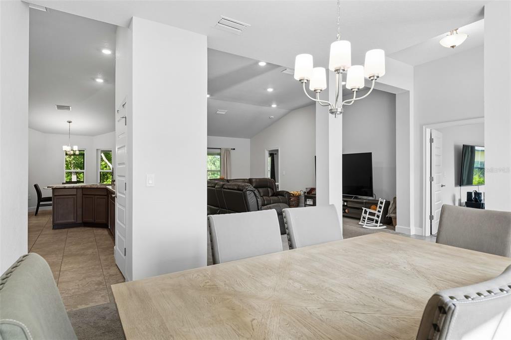 463 Trafalgar Lane Spring Hill, FL 34606 - Photo 7 of 36 a bedroom with a bed and a flat tv screen on dresser