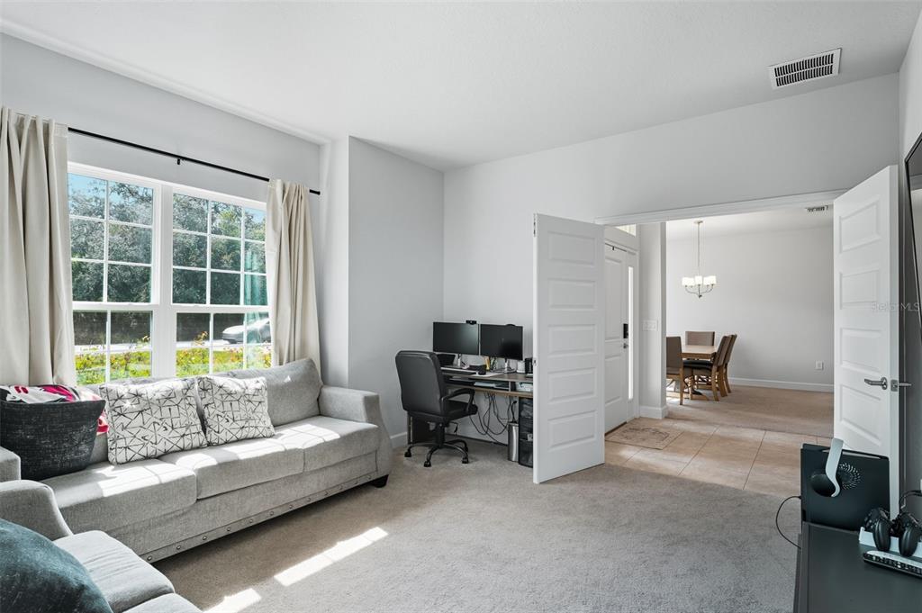 463 Trafalgar Lane Spring Hill, FL 34606 - Photo 10 of 36 a living room with furniture and a window