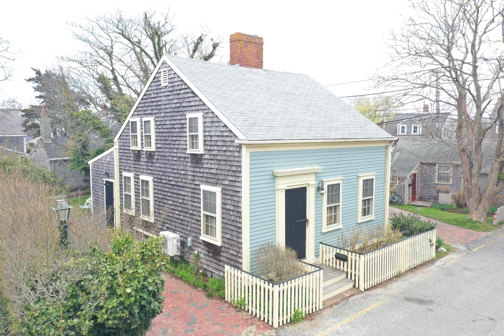 1 Beaver Street Nantucket, MA 02554 - Photo 1 of 28 a view of a house with backyard and trees