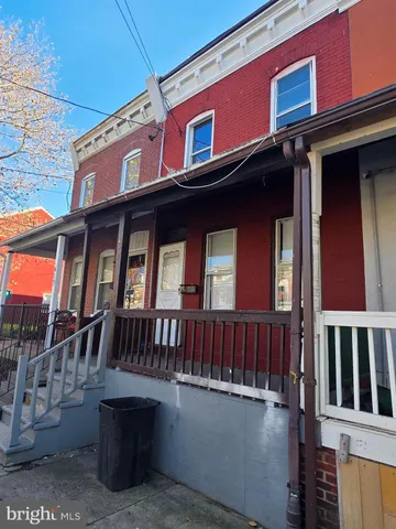 a view of a brick building with many windows