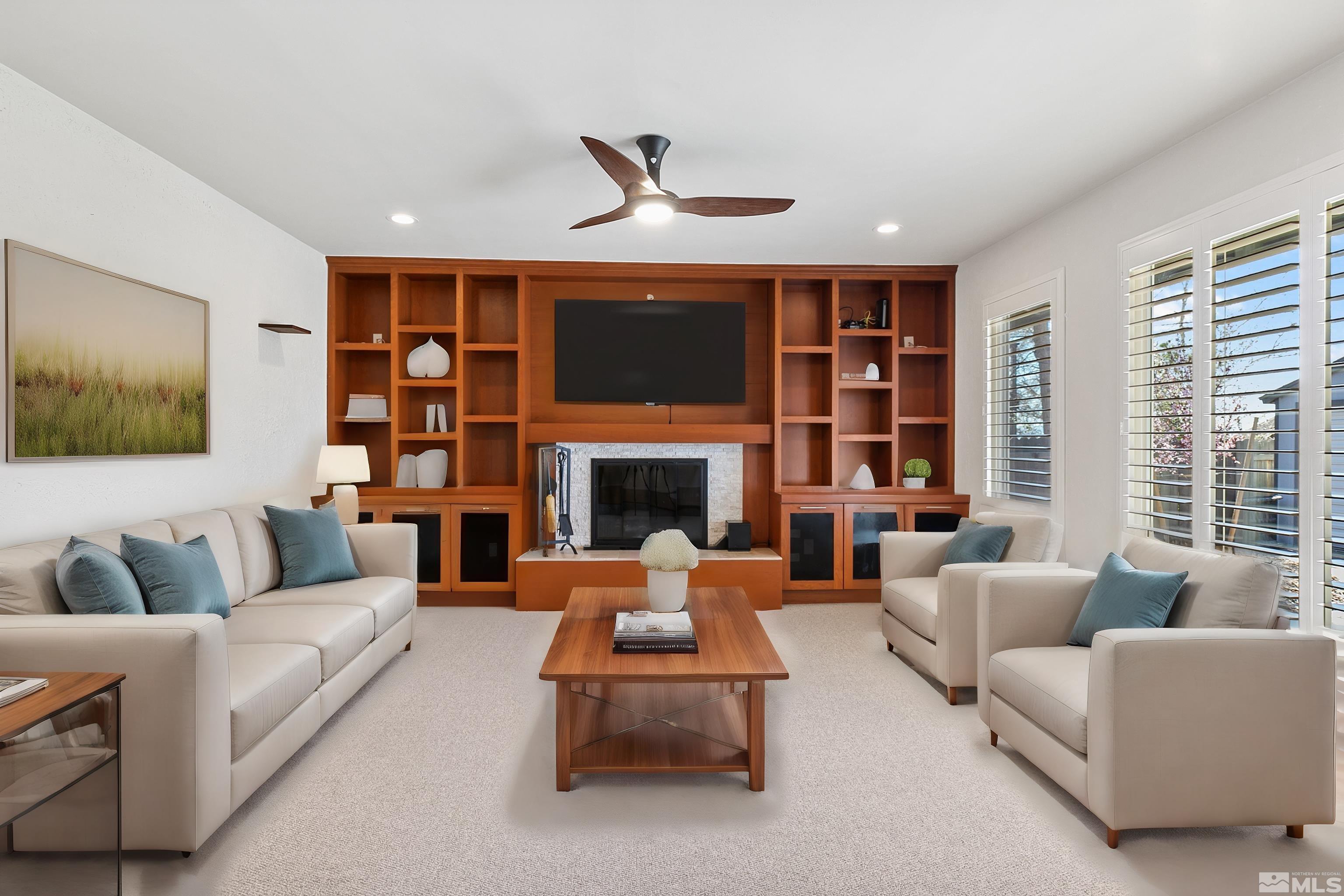420 Tarn Way Reno, NV 89503 - Photo 3 of 35 a living room with furniture ceiling fan and a fireplace