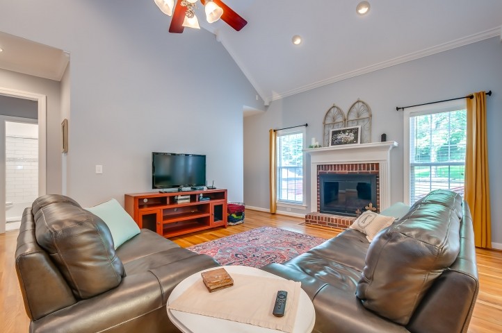 1169 Rip Steele Road Columbia, TN 38401 - Photo 18 of 42 a living room with furniture and a fireplace
