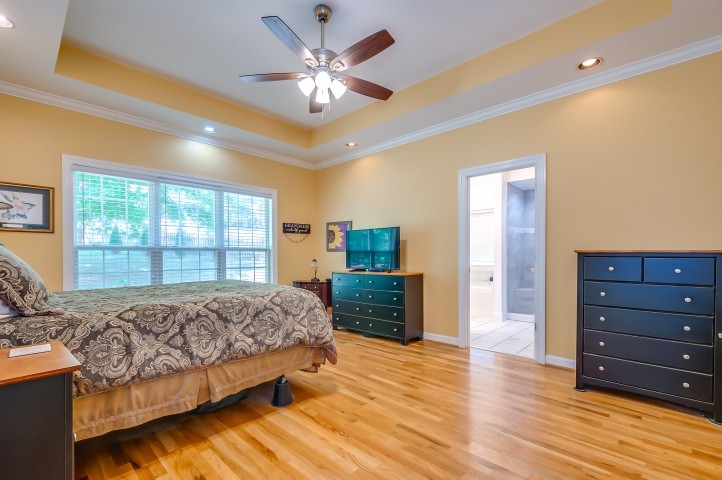 1169 Rip Steele Road Columbia, TN 38401 - Photo 21 of 42 a spacious bedroom with a bed and wooden floor