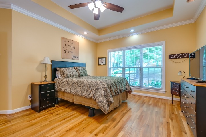 1169 Rip Steele Road Columbia, TN 38401 - Photo 22 of 42 a bedroom with a large bed and a large window