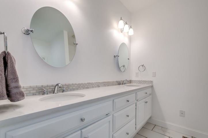 1169 Rip Steele Road Columbia, TN 38401 - Photo 23 of 42 a bathroom with a double vanity sink and a mirror