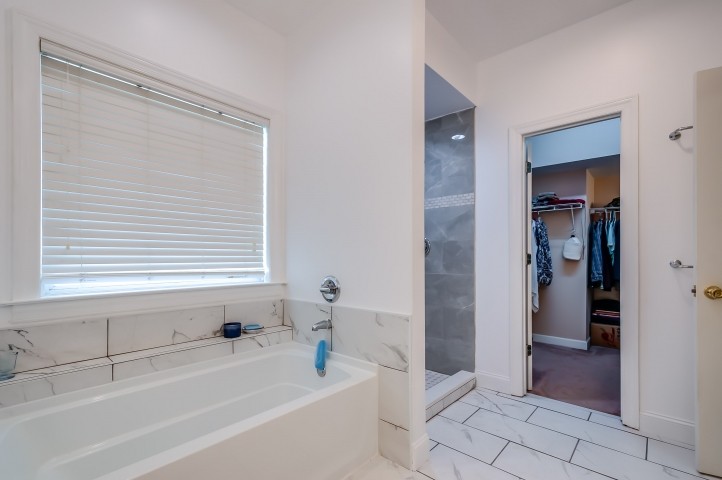 1169 Rip Steele Road Columbia, TN 38401 - Photo 24 of 42 a bathroom with a bathtub and a shower