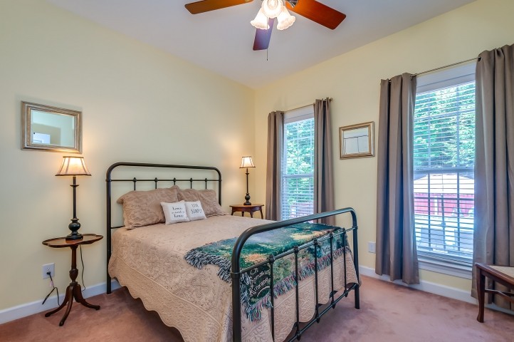 1169 Rip Steele Road Columbia, TN 38401 - Photo 29 of 42 a bedroom with a bed and a chandelier