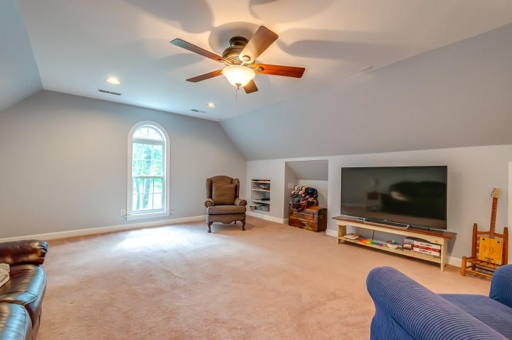 1169 Rip Steele Road Columbia, TN 38401 - Photo 32 of 42 a living room with furniture and a flat screen tv