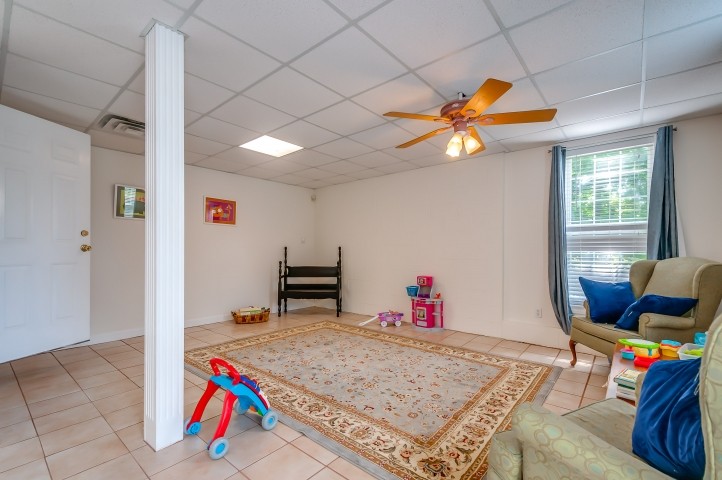 1169 Rip Steele Road Columbia, TN 38401 - Photo 34 of 42 a room with furniture and a chandelier