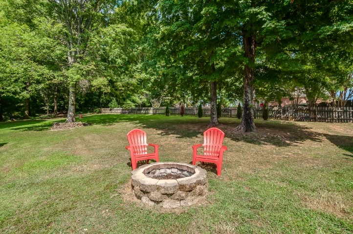 1169 Rip Steele Road Columbia, TN 38401 - Photo 36 of 42 a backyard of a house with table and chairs