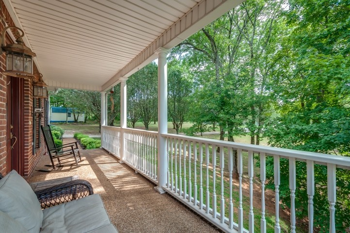 1169 Rip Steele Road Columbia, TN 38401 - Photo 8 of 42 a view of a patio with a table chairs and a backyard