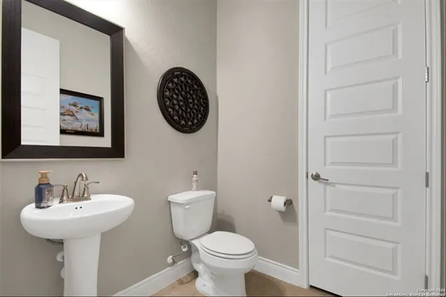 a bathroom with a toilet and a sink