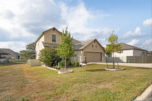 a house view with swimming pool in front of it