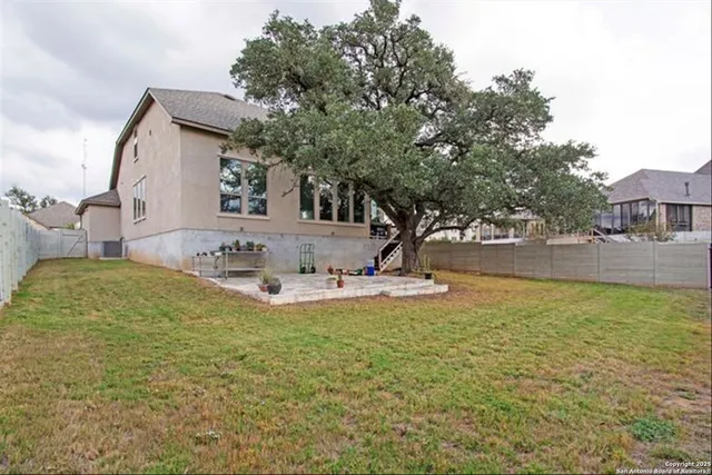 a view of a swimming pool with outdoor seating and yard