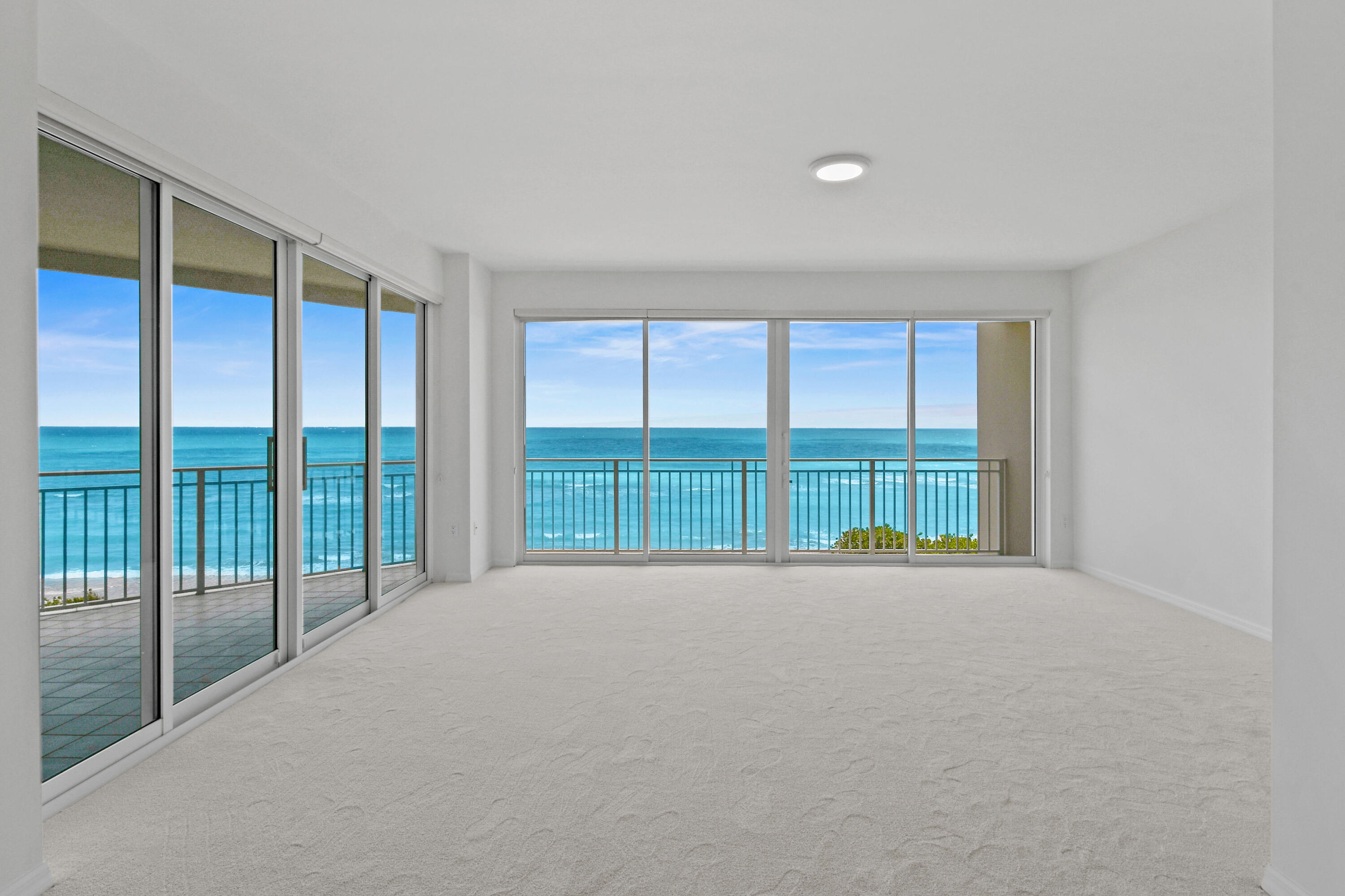 1660 Florida A1A, Unit 352 Jupiter, FL 33477 - Photo 5 of 36 a view of an empty room with a balcony
