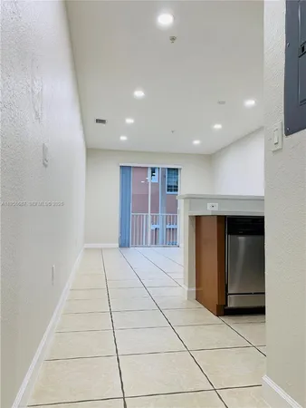 a kitchen with stainless steel appliances a stove microwave and sink