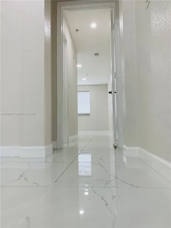 an empty room with white walls