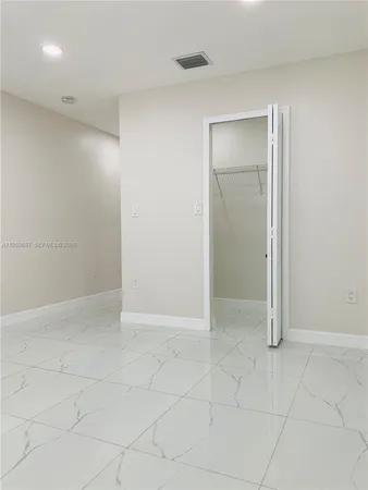 an empty room with white walls