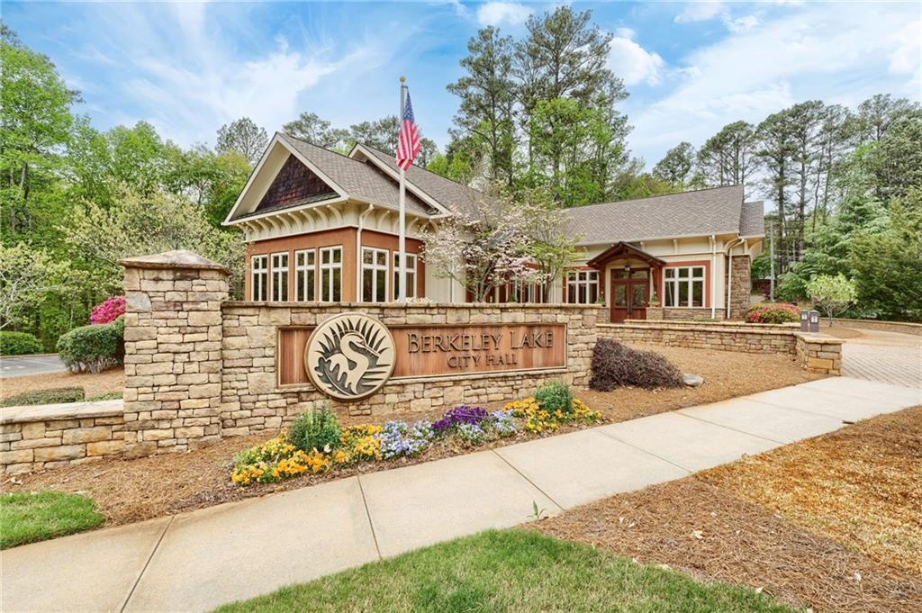 4205 South Berkeley Lake Road Northwest Berkeley Lake, GA 30096 - Photo 28 of 34 a front view of a house with garden