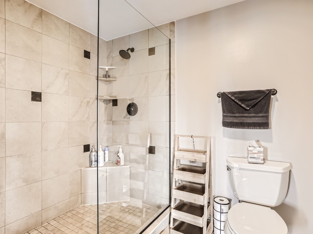 421 Salt Lick Circle, Unit 421 Silverthorne, CO 80498 - Photo 13 of 21 a bathroom with a toilet a sink and shower