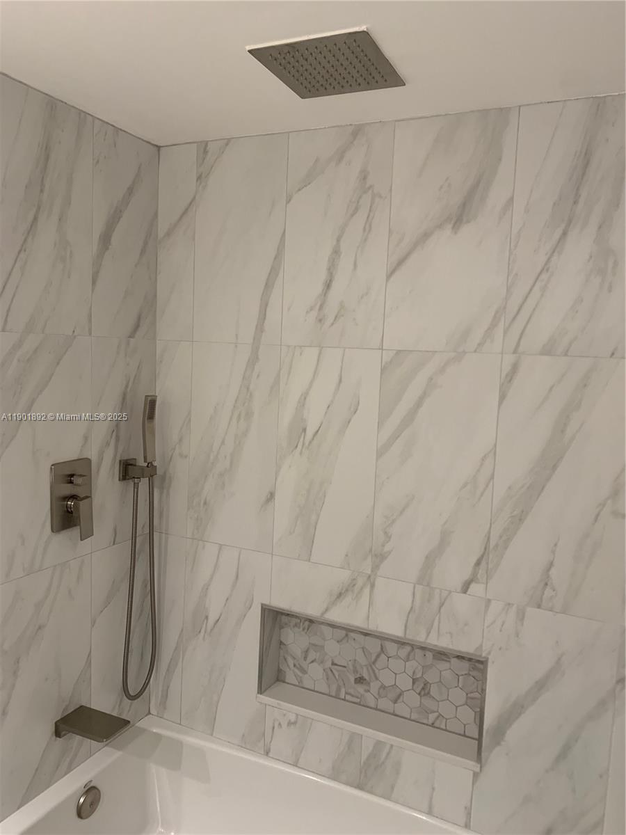 6102 Southeast Landing Way, Unit 2 Stuart, FL 34997 - Photo 18 of 51 a bathroom with a shower