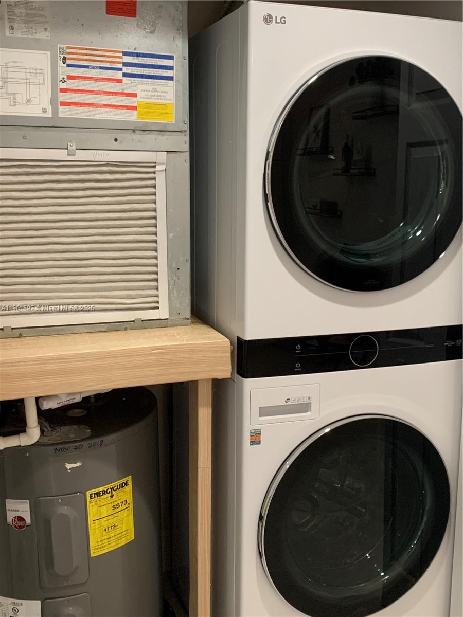 6102 Southeast Landing Way, Unit 2 Stuart, FL 34997 - Photo 19 of 51 a utility room with dryer and washer