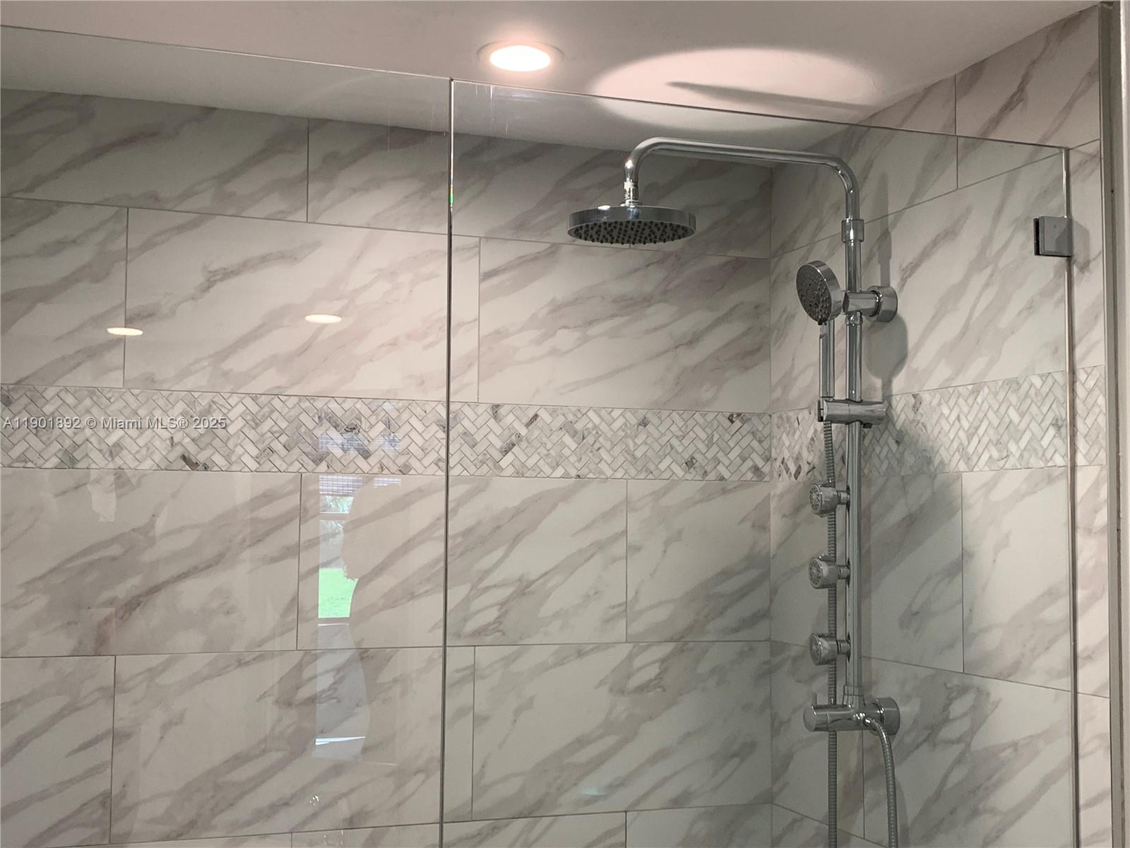 6102 Southeast Landing Way, Unit 2 Stuart, FL 34997 - Photo 36 of 51 a bathroom with a shower