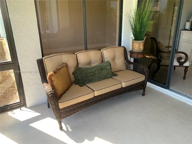 a outdoor living space with furniture and a potted plant