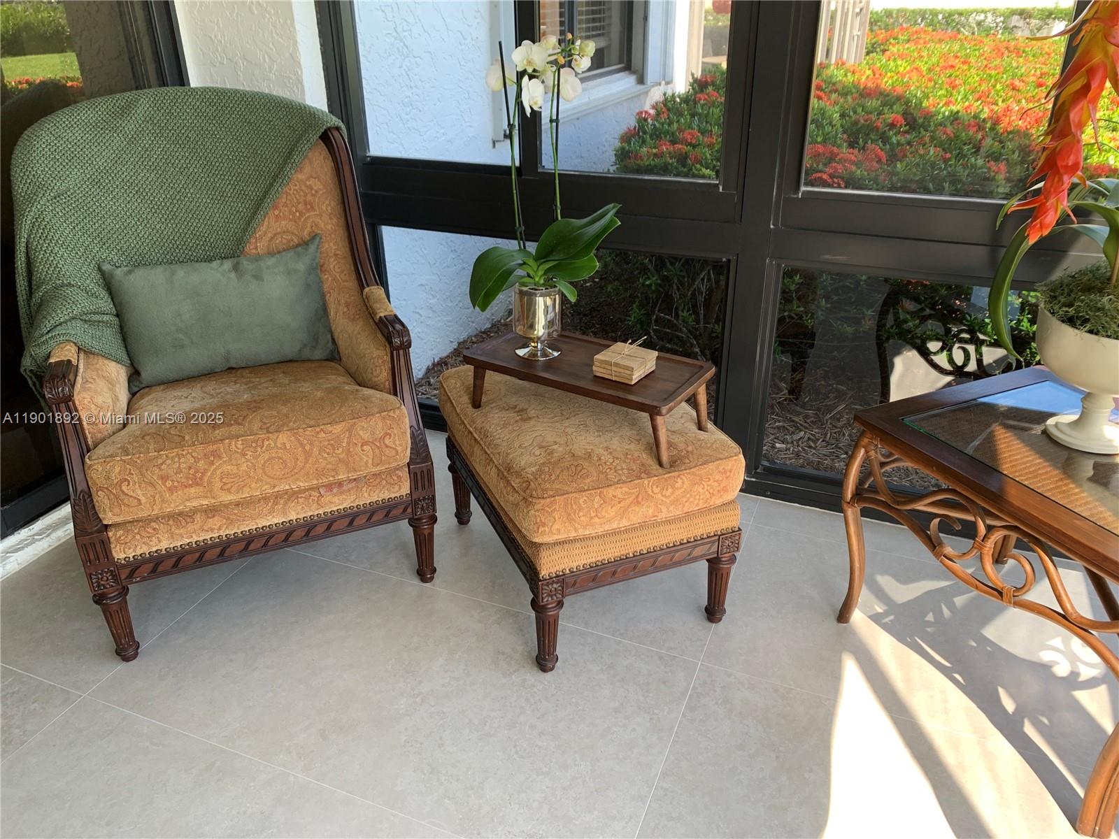 6102 Southeast Landing Way, Unit 2 Stuart, FL 34997 - Photo 38 of 51 a outdoor living space with furniture and a potted plant