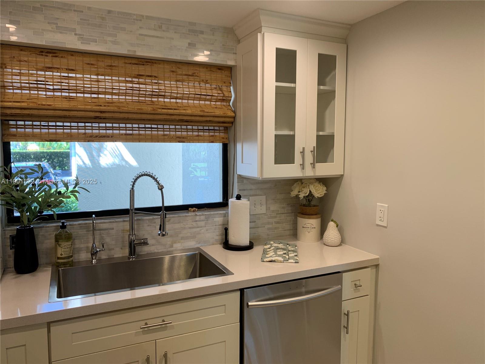 6102 Southeast Landing Way, Unit 2 Stuart, FL 34997 - Photo 9 of 51 a kitchen with a sink and cabinets