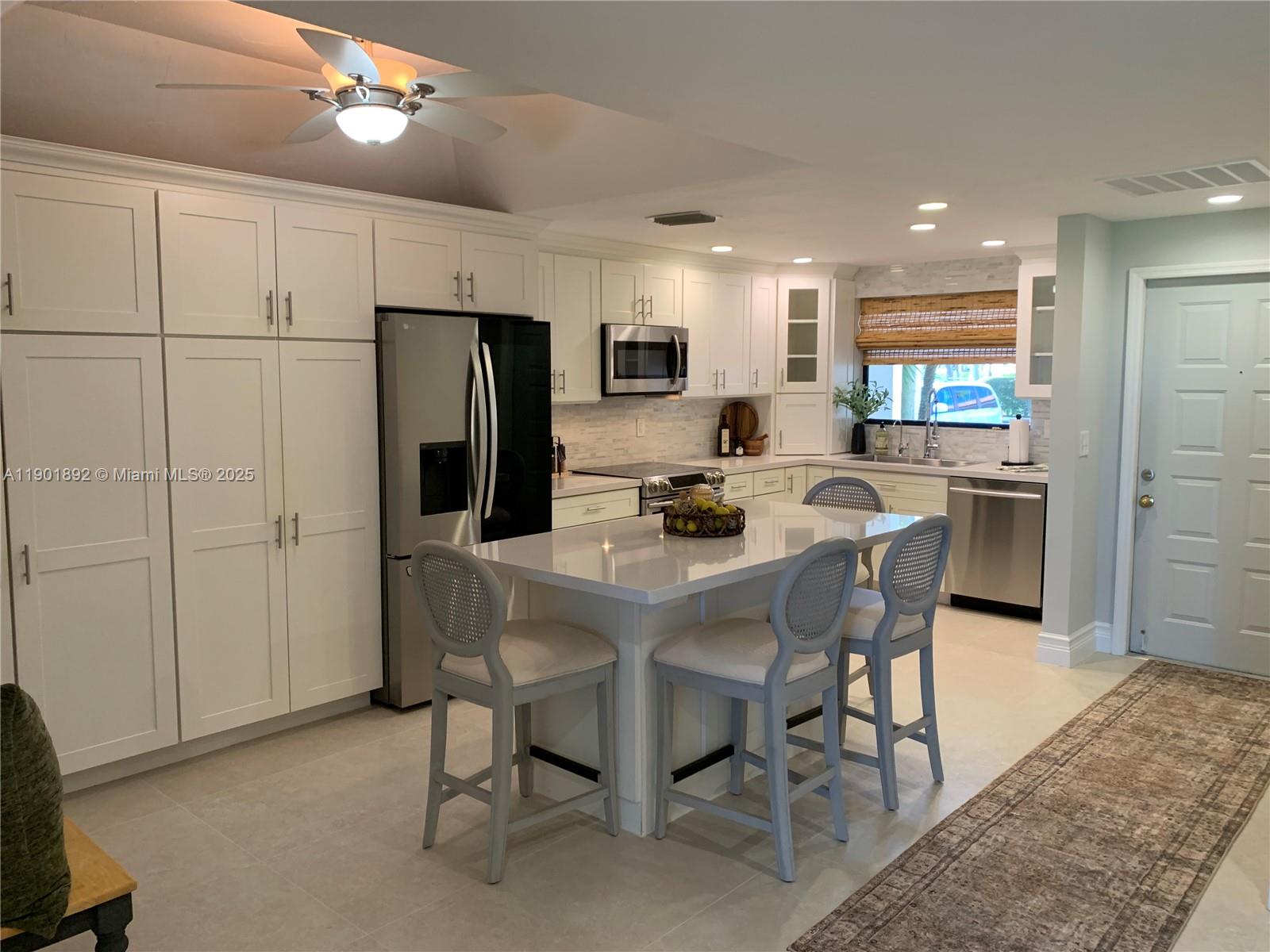 6102 Southeast Landing Way, Unit 2 Stuart, FL 34997 - Photo 10 of 51 a view of a dining room with furniture