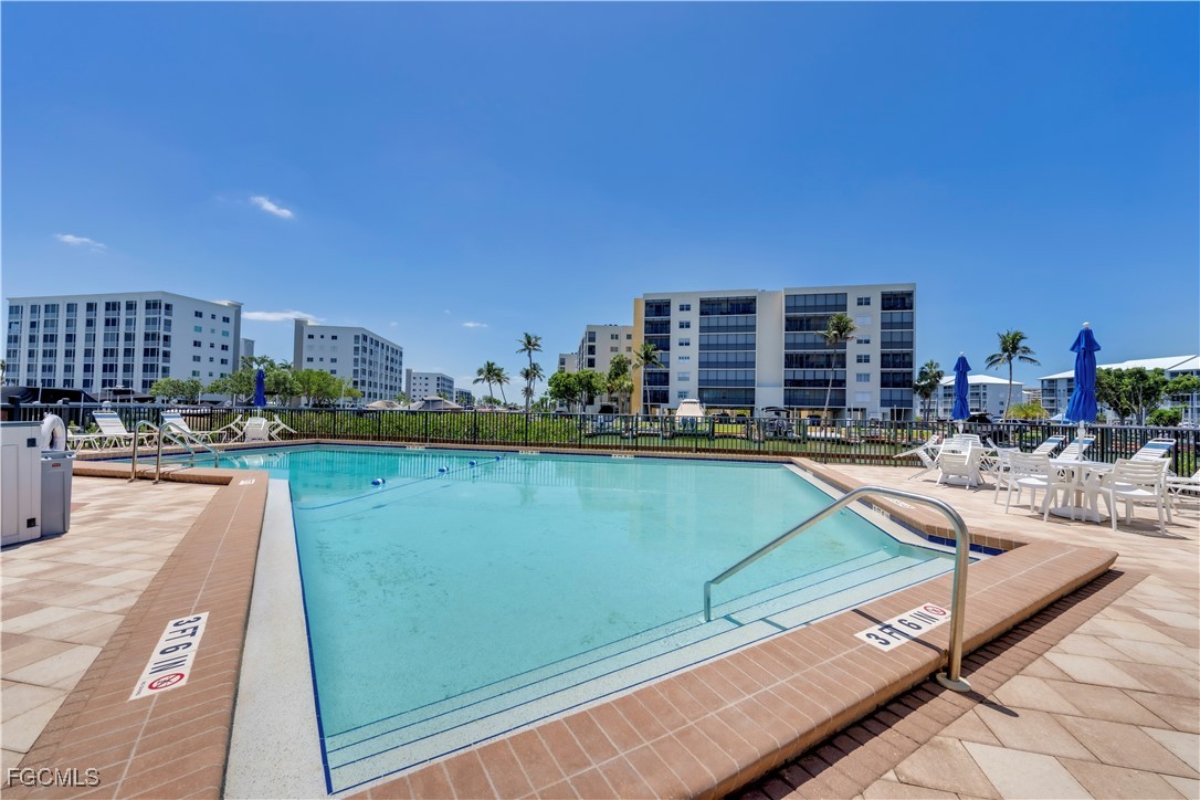 200 Lenell Road, Unit 218 Fort Myers Beach, FL 33931 - Photo 16 of 17 a view of a swimming pool and outdoor space