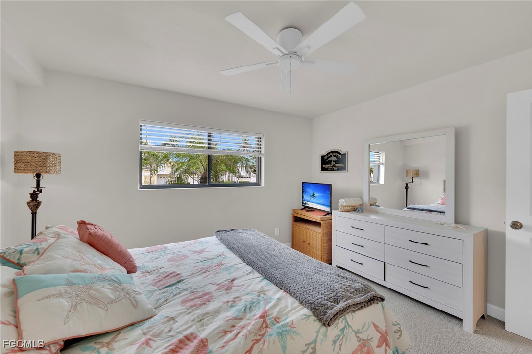 200 Lenell Road, Unit 218 Fort Myers Beach, FL 33931 - Photo 8 of 17 a bedroom with a bed and a dresser in it