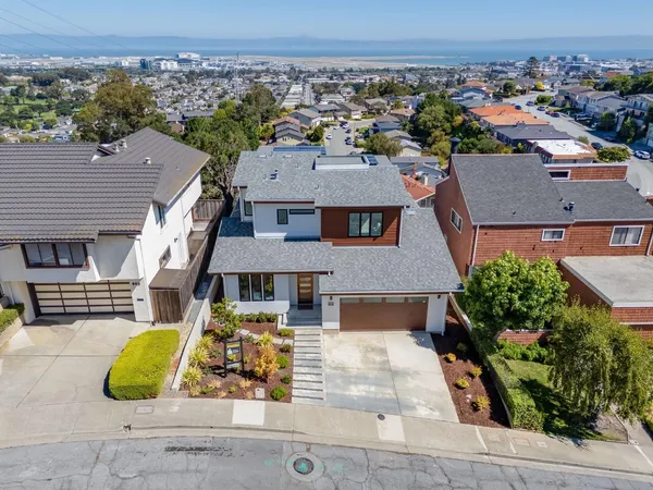 an aerial view of a house with swimming pool