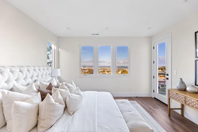 a bedroom with a bed and a couch