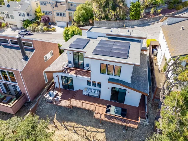 an aerial view of a house with swimming pool