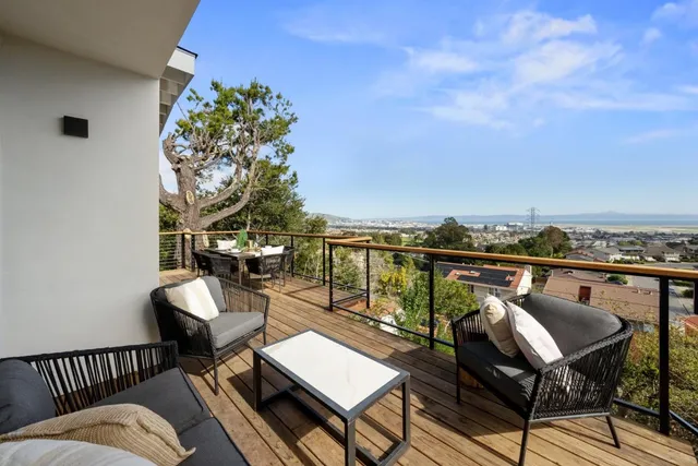 a view of a balcony with chairs