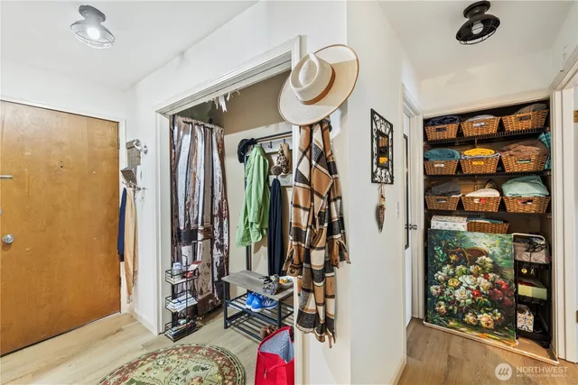 a view of a room with lots of stuff and hardwood floor