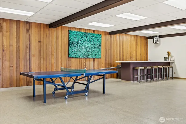 a reading room with furniture and a window