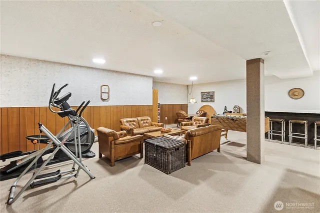 a room with furniture and pool table