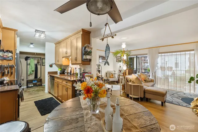 a living room with lots of furniture and a large window
