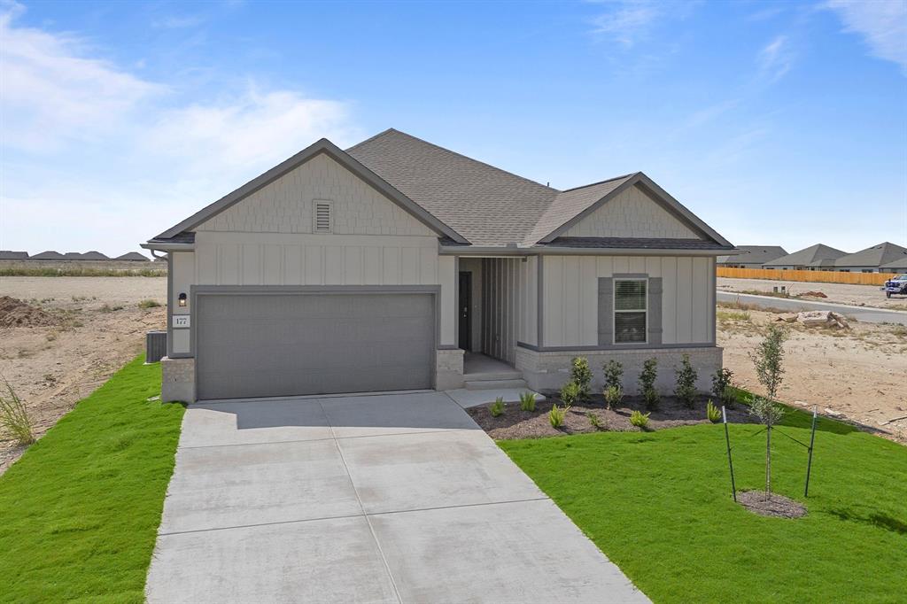 177 Sleep Hollow Jarrell, TX 76537 - Photo 1 of 24 Single-story residence featuring a neutral exterior with vertical and horizontal siding