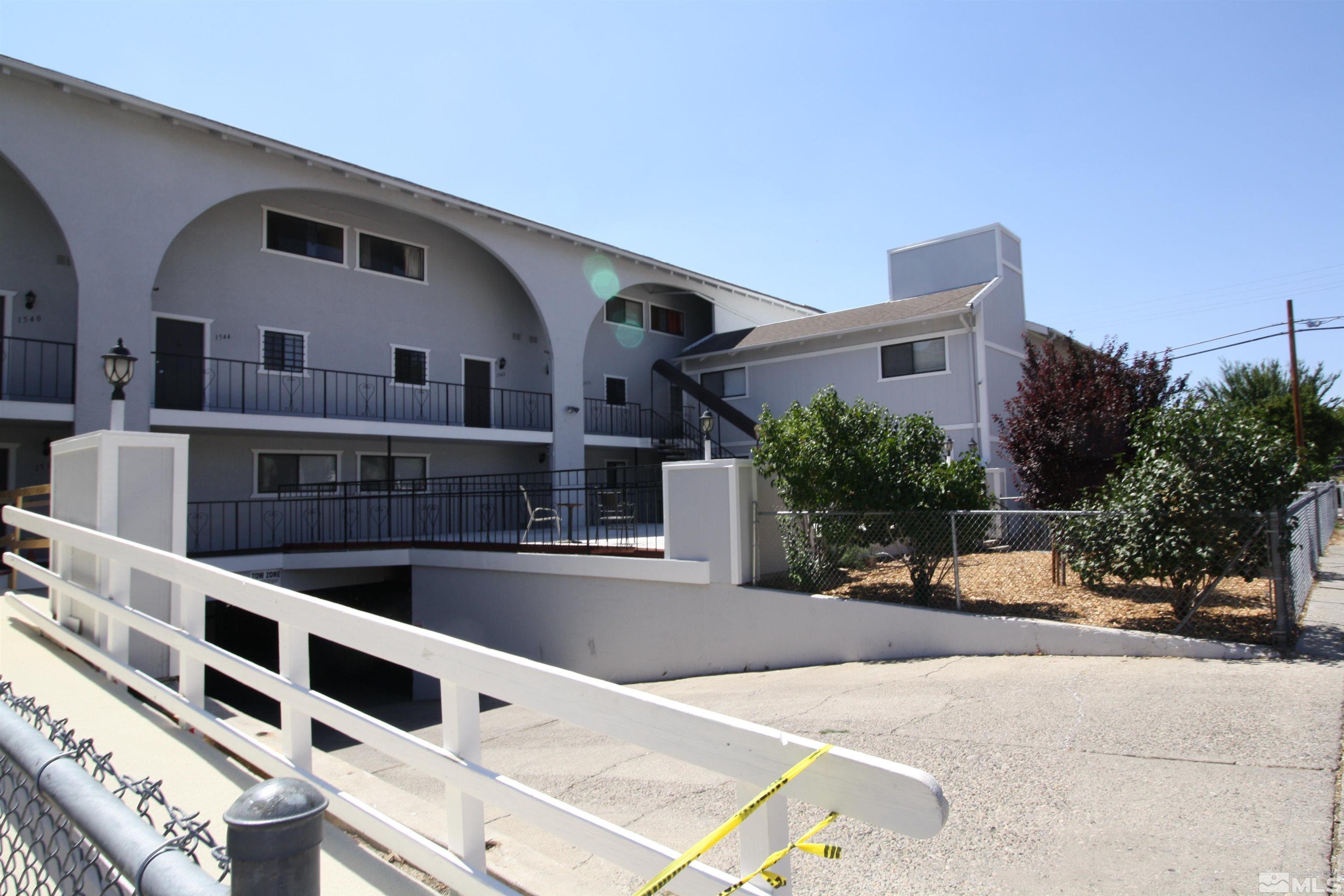 1540 Carlin Street, Unit BLD #1 Reno, NV 89503 - Photo 1 of 11 a front view of a house with a yard