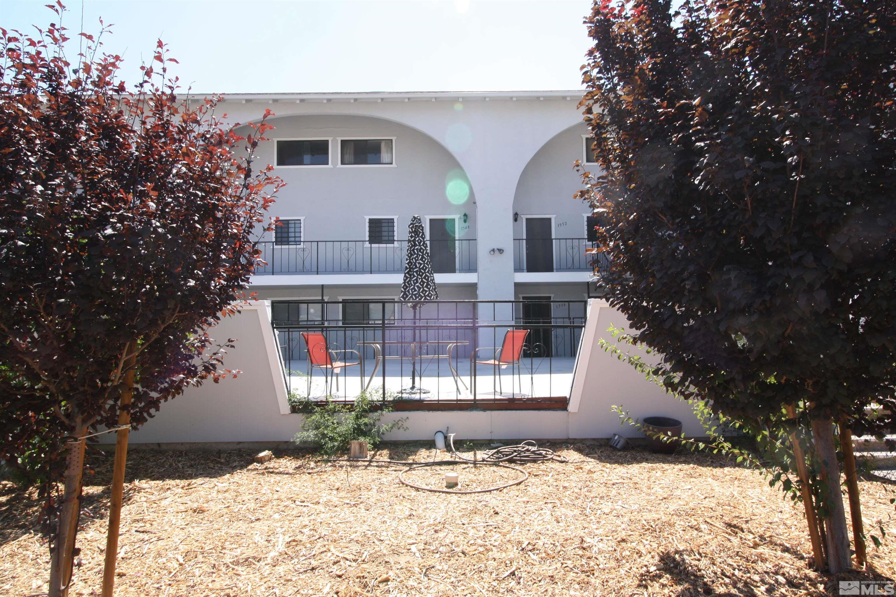 1540 Carlin Street, Unit BLD #1 Reno, NV 89503 - Photo 2 of 11 a front view of a house with a yard covered with snow