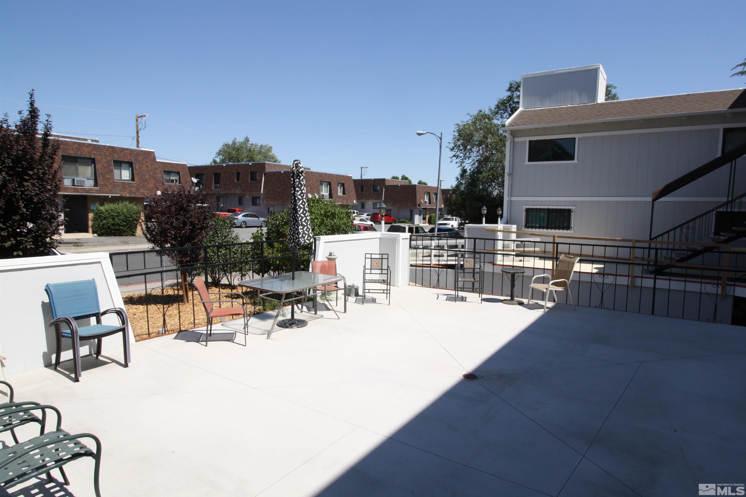 1540 Carlin Street, Unit BLD #1 Reno, NV 89503 - Photo 4 of 11 a view of dinning table and chairs in patio